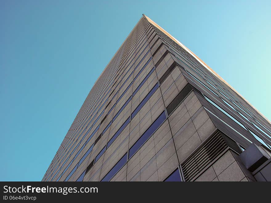 Tokyo office building under clear blue sky. Tokyo office building under clear blue sky.