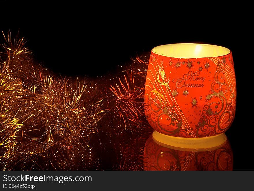 View of a Christmas candle in glass with inscriptions. View of a Christmas candle in glass with inscriptions