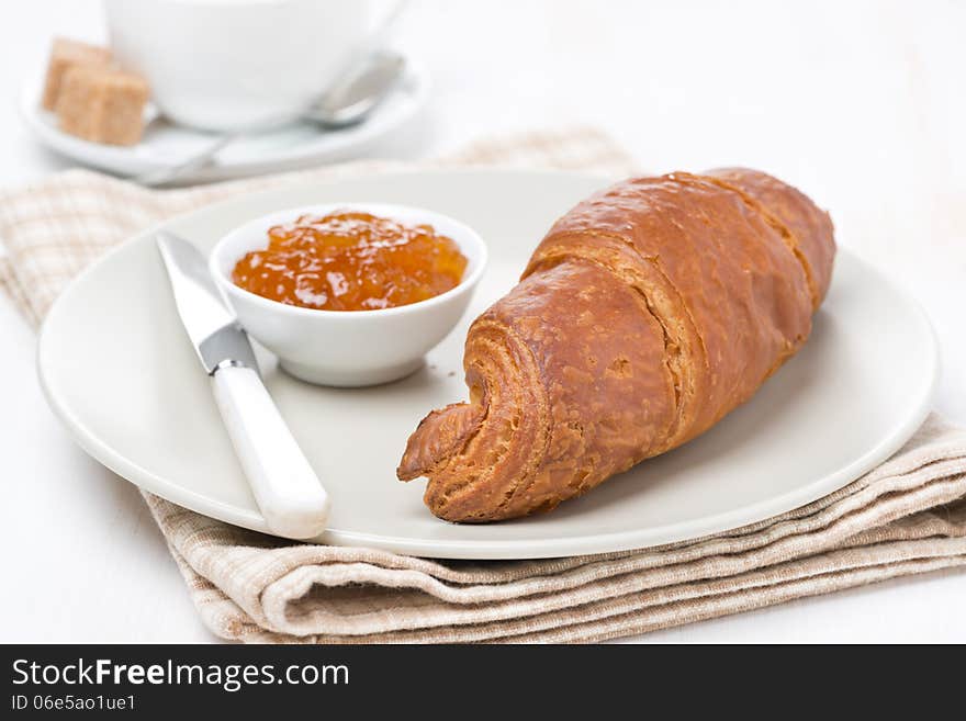 Fresh croissant with jam for breakfast