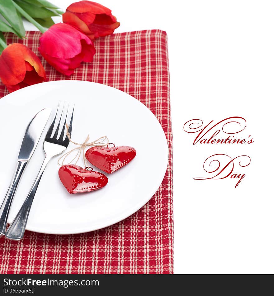 Festive table setting for Valentine's Day with tulips, isolated on white. Festive table setting for Valentine's Day with tulips, isolated on white