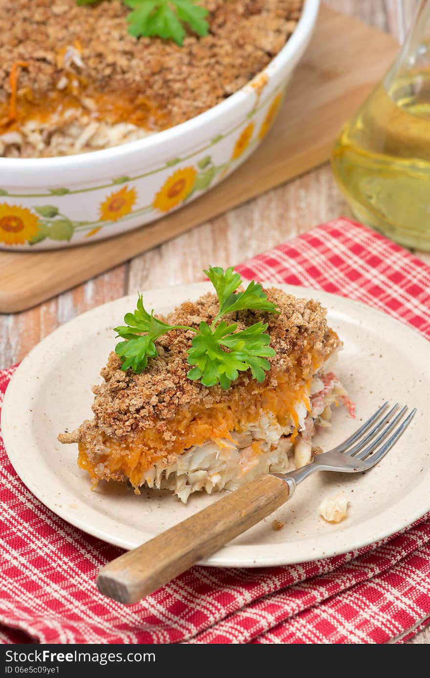 Gratin with fish and pumpkin on the plate