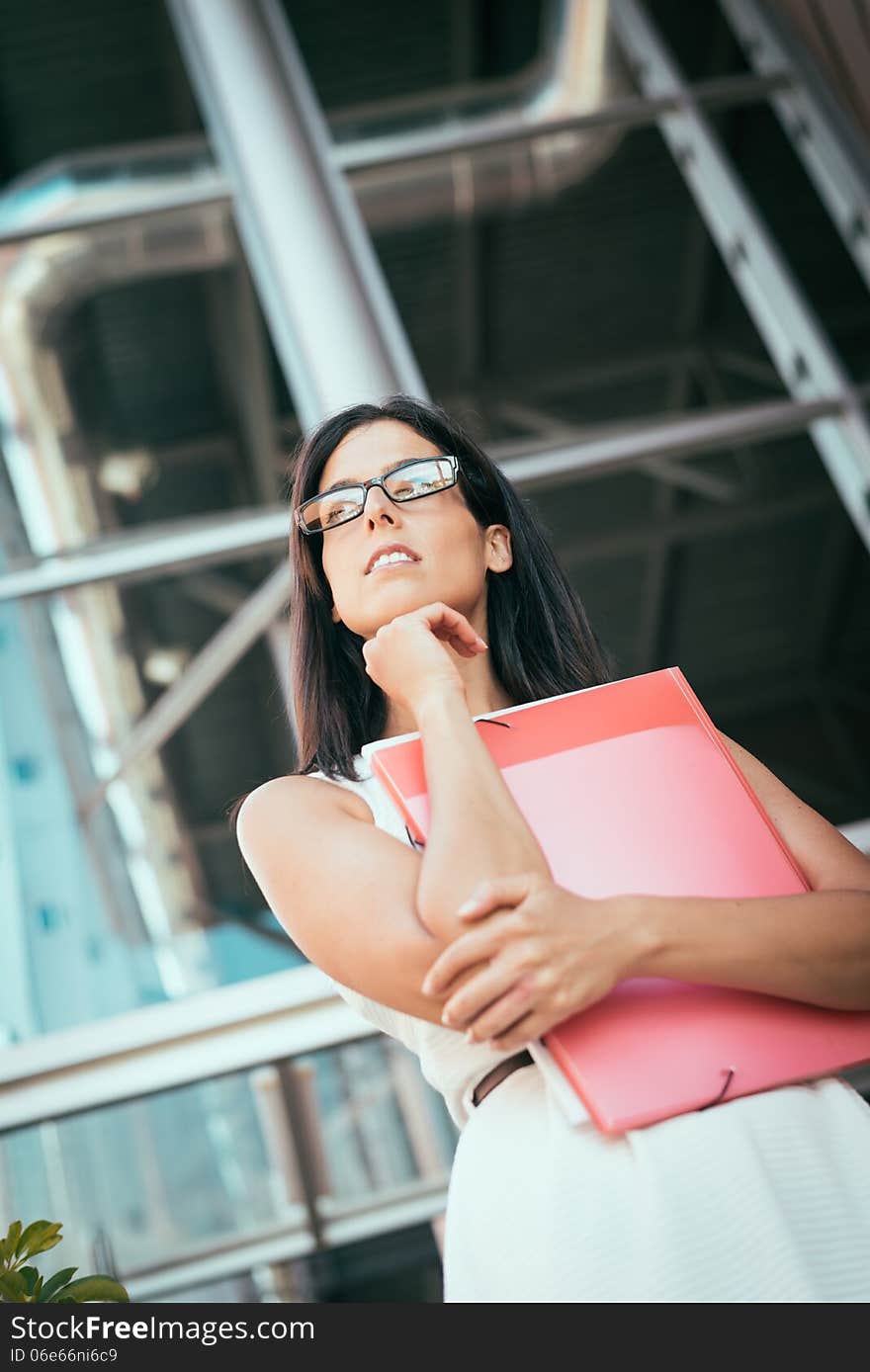 Pensive modern casual businesswoman or female student. Professional woman thinking about the future concept. Pensive modern casual businesswoman or female student. Professional woman thinking about the future concept.