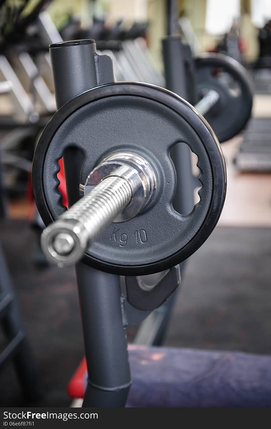 Barbell ready to workout, indooors, shallow DOF