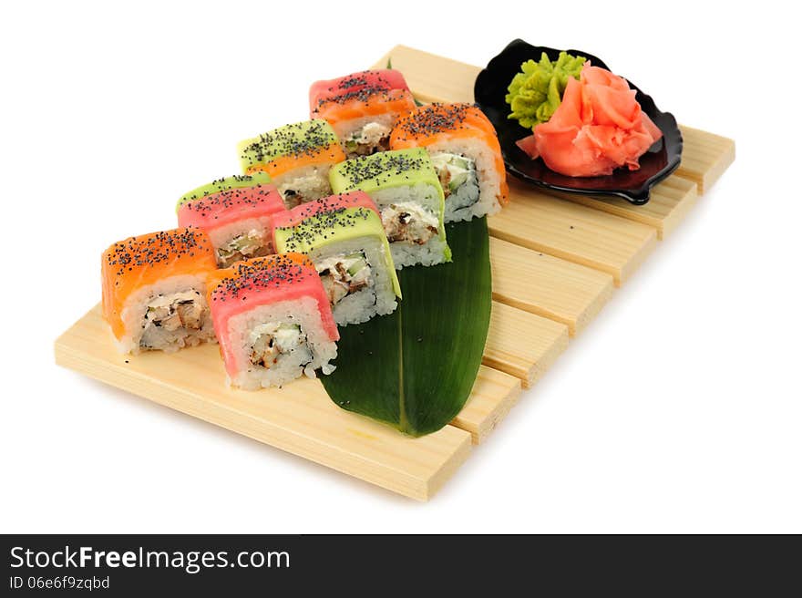 Rainbow sushi at wooden plate, isolated on white