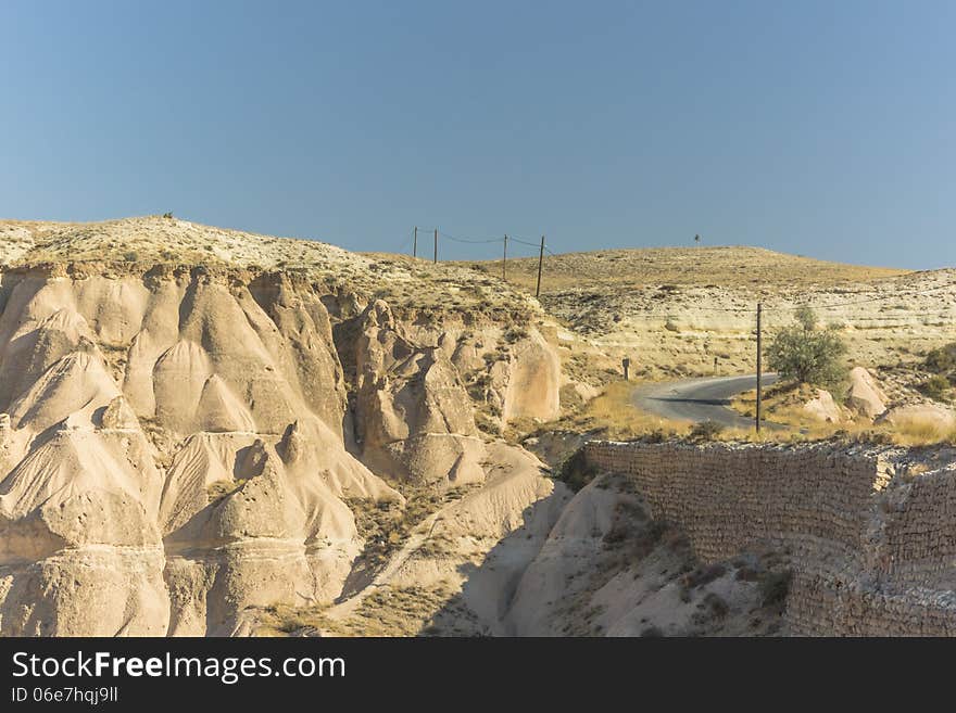 Warm Glow of Sunset on the Fairy Chimneys of Cappadocia, Popular Travel Destination in Central Turkey. Warm Glow of Sunset on the Fairy Chimneys of Cappadocia, Popular Travel Destination in Central Turkey