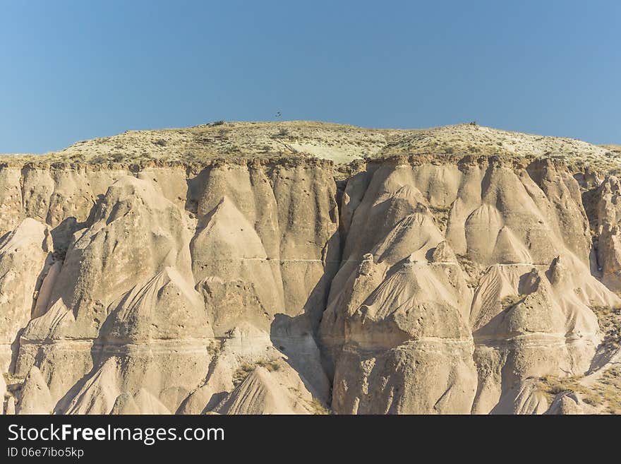 Warm Glow of Sunset on the Fairy Chimneys of Cappadocia, Popular Travel Destination in Central Turkey. Warm Glow of Sunset on the Fairy Chimneys of Cappadocia, Popular Travel Destination in Central Turkey