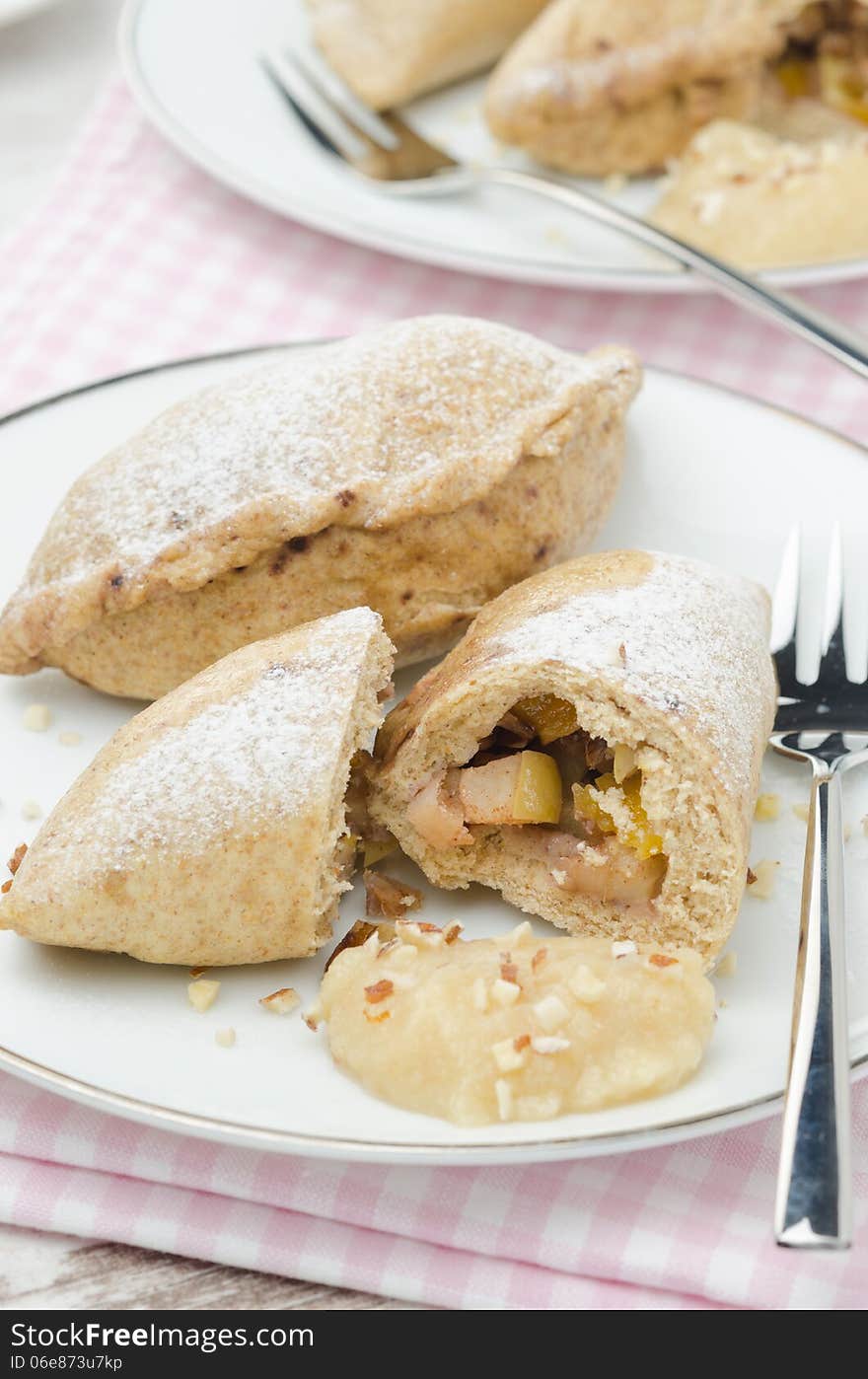 Whole-grain pies with apples and nuts vertical closeup