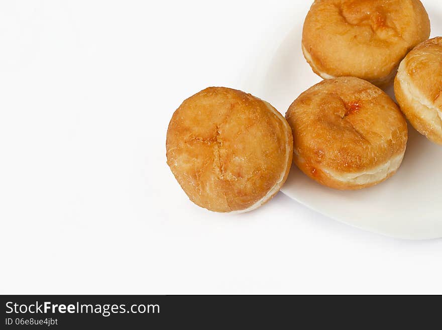 Bismark doughnuts on plate isolated on white background. Bismark doughnuts on plate isolated on white background