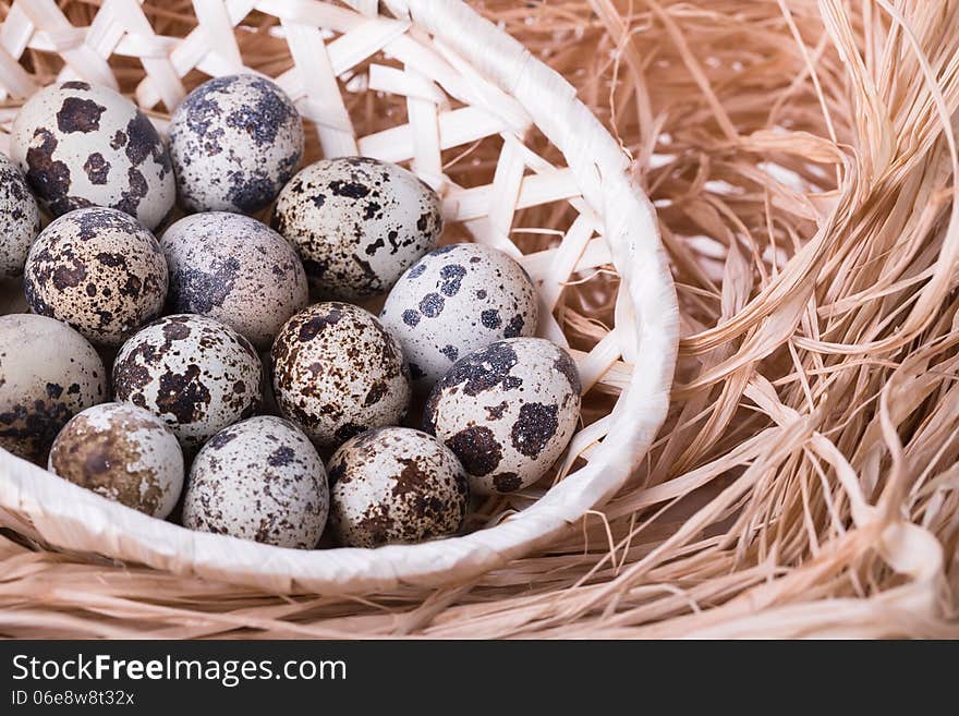 Fresh quail eggs in a basket