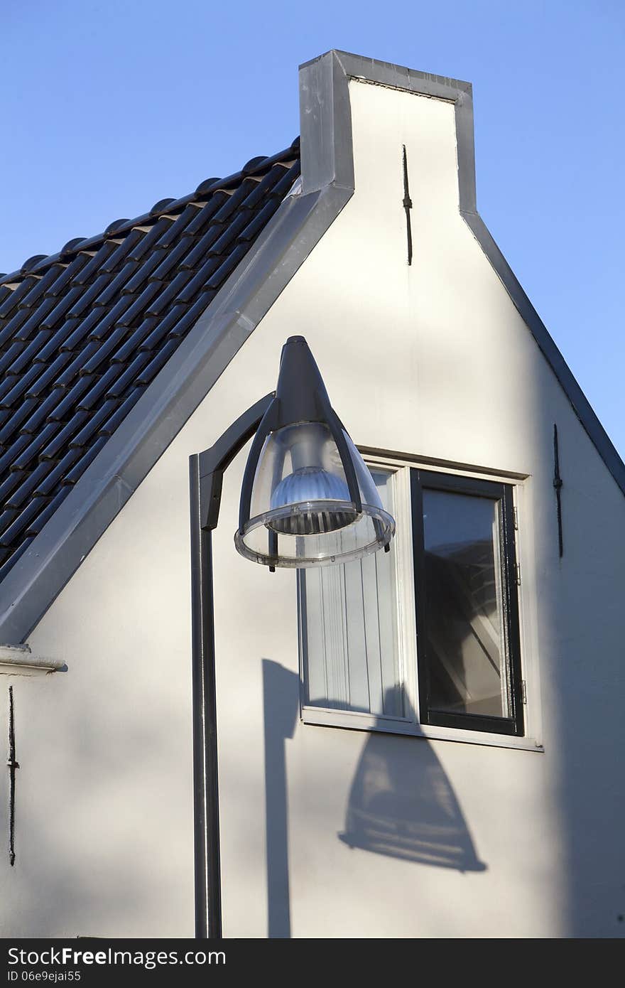 Lamppost and nice shadow on an old house in Vlaardingen, Netherlands