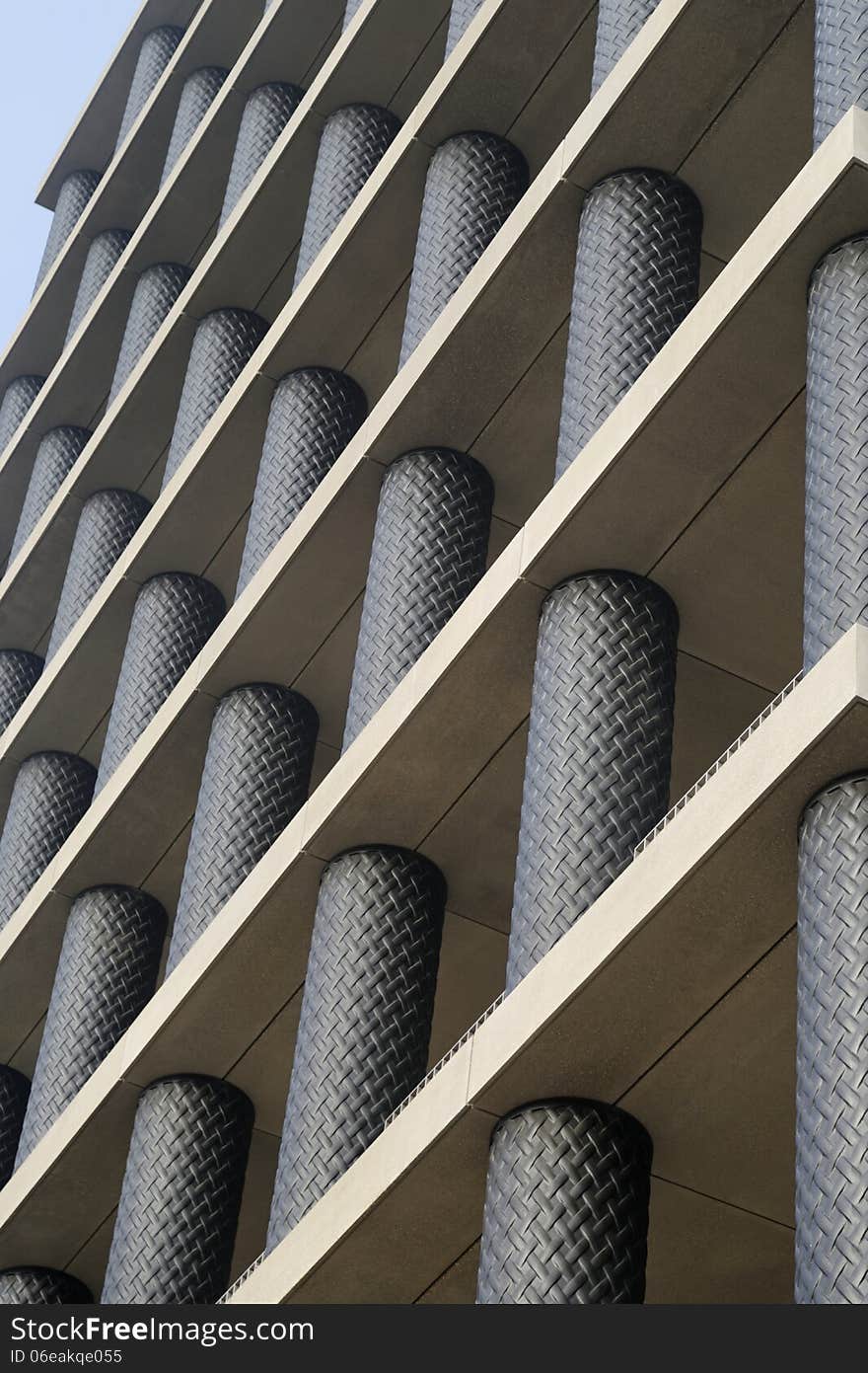 Image taken of a new modern commercial building with black tubes in London, England. Image taken of a new modern commercial building with black tubes in London, England