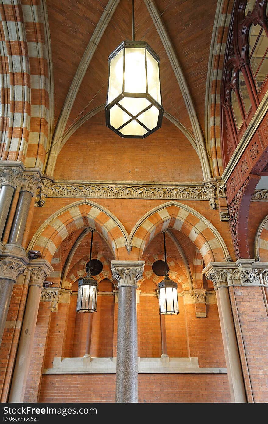 Image of ornate Victorian arch with period lighting taken in London, england