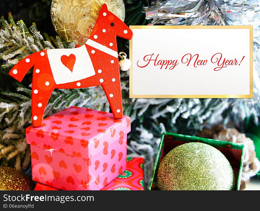 Horse toy(year) with gift boxes on festive background. Horse toy(year) with gift boxes on festive background