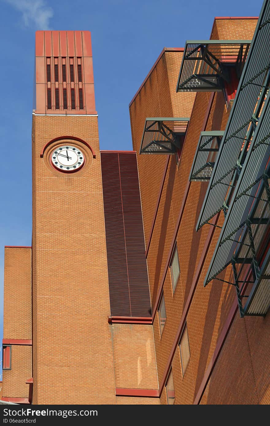 Clocktower of the British Library, Euston, London, England, UK, bathed in late afternoon winter sun. Clocktower of the British Library, Euston, London, England, UK, bathed in late afternoon winter sun.