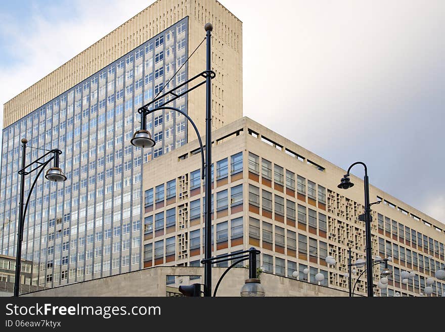 Wide angle image of office Windows and lamp posts and sky background taken in London, england