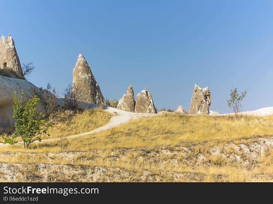 Warm Glow of Sunset on the Fairy Chimneys of Cappadocia, Popular Travel Destination in Central Turkey. Warm Glow of Sunset on the Fairy Chimneys of Cappadocia, Popular Travel Destination in Central Turkey