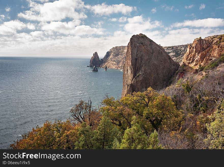 Ukraine, peninsula of Crimea, Sea coast on the Black Sea, large and small pebbles, large boulders, sea waves. Ukraine, peninsula of Crimea, Sea coast on the Black Sea, large and small pebbles, large boulders, sea waves