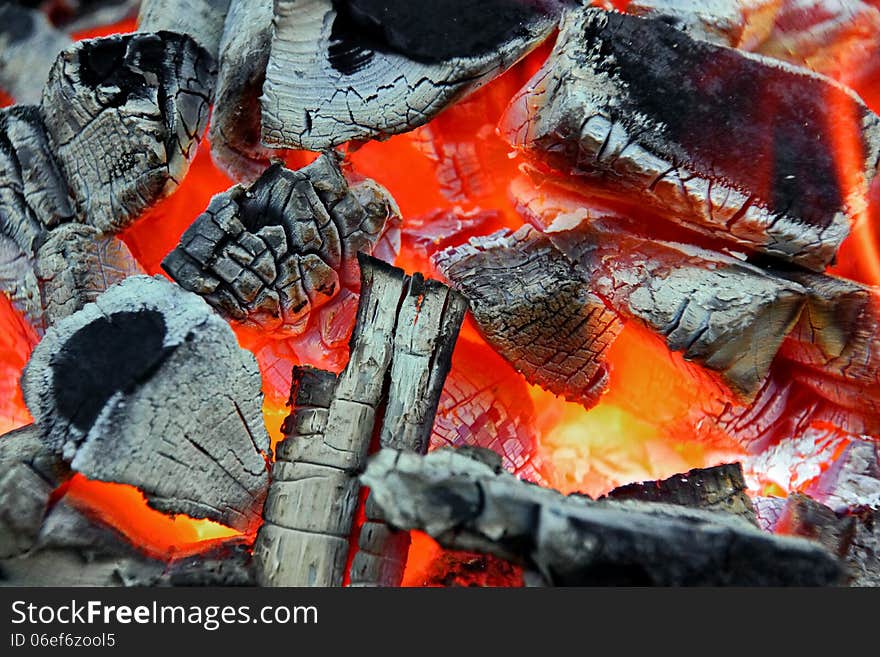 Glowing Charcoal And Flame In BBQ