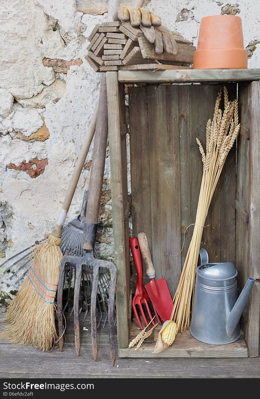 Equipment and gardening tools in a rustic setting. Equipment and gardening tools in a rustic setting