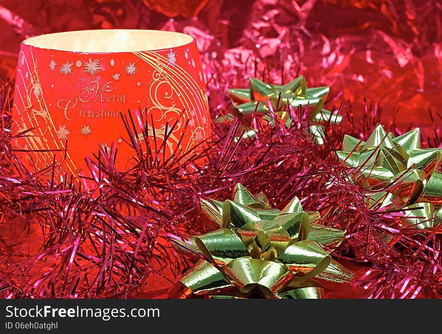 View of a Christmas candle in glass with inscriptions. View of a Christmas candle in glass with inscriptions