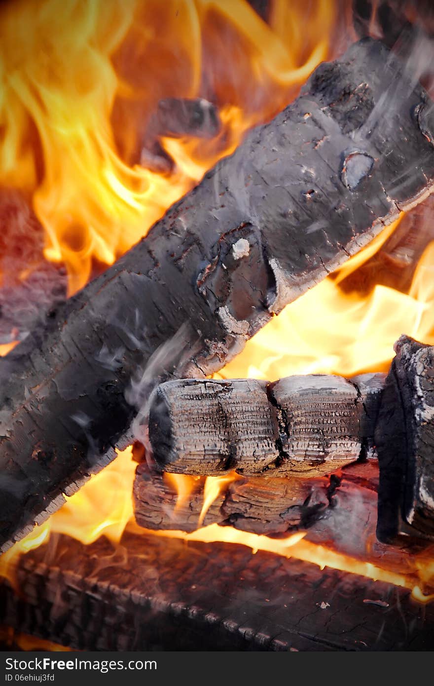 Birch firewood flaming in BBQ Grill. Birch firewood flaming in BBQ Grill