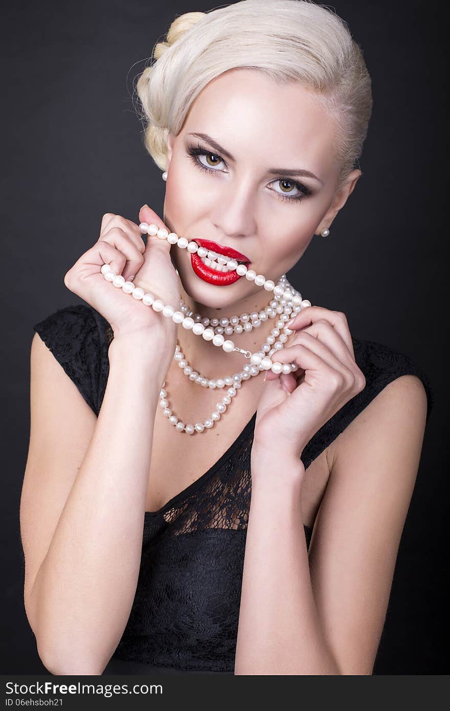 girl with blond hair with pearls. girl with blond hair with pearls