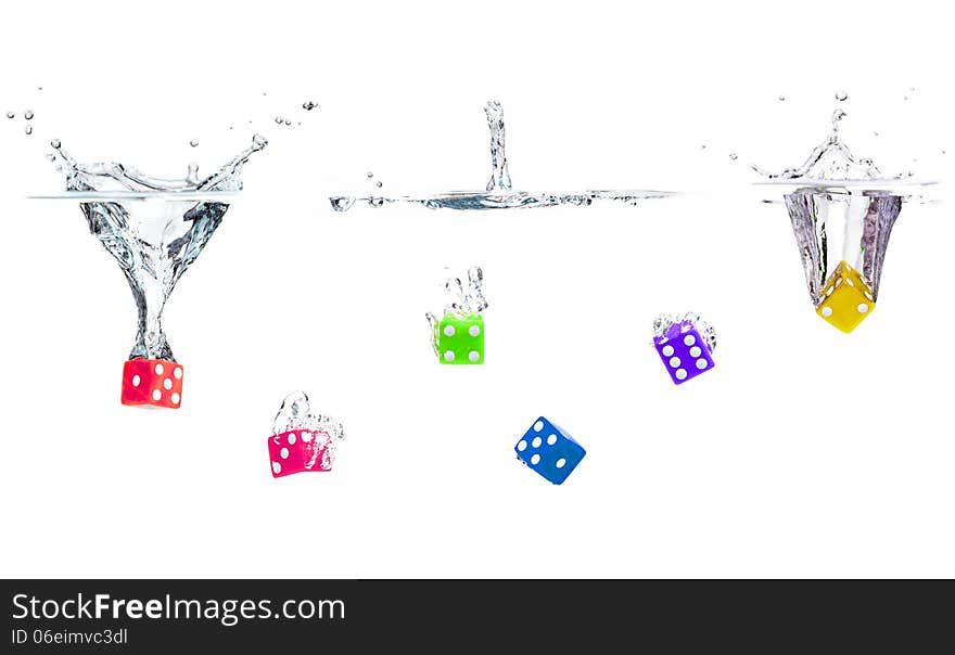 Colorful dices falling into the water. Colorful dices falling into the water