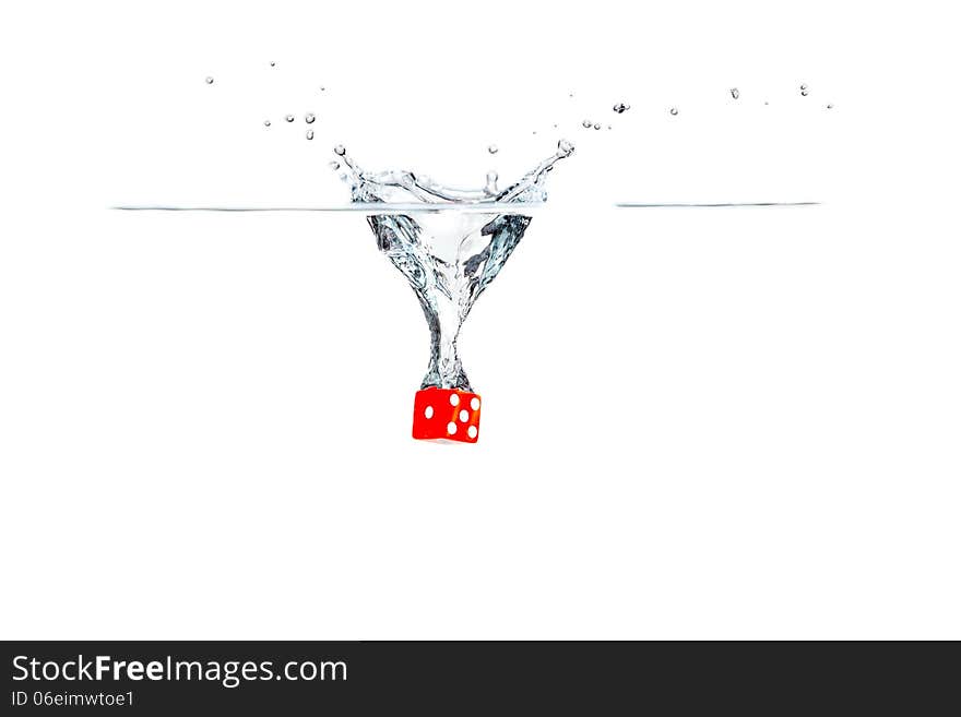 Red dice falling into the water. Red dice falling into the water