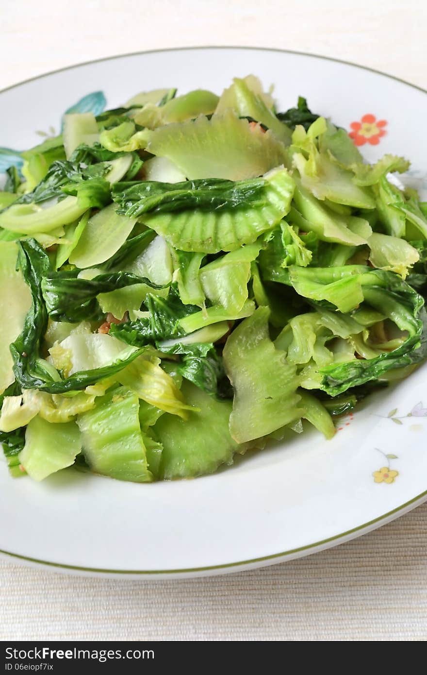 Chinese fry stir vegetables in dish.