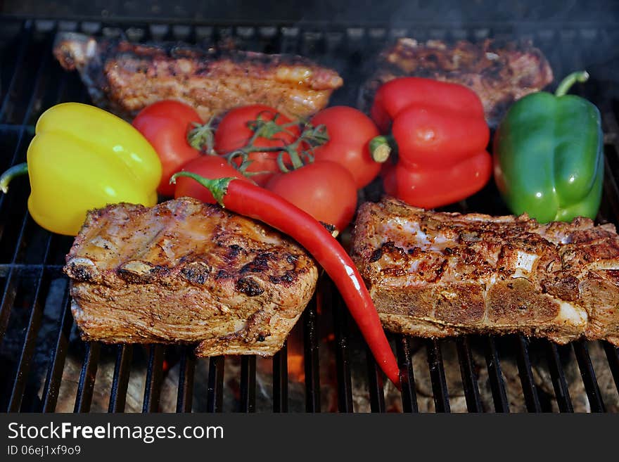 Pork Ribs, brisket, belly roasted in BBQ with vegetables. Pork Ribs, brisket, belly roasted in BBQ with vegetables