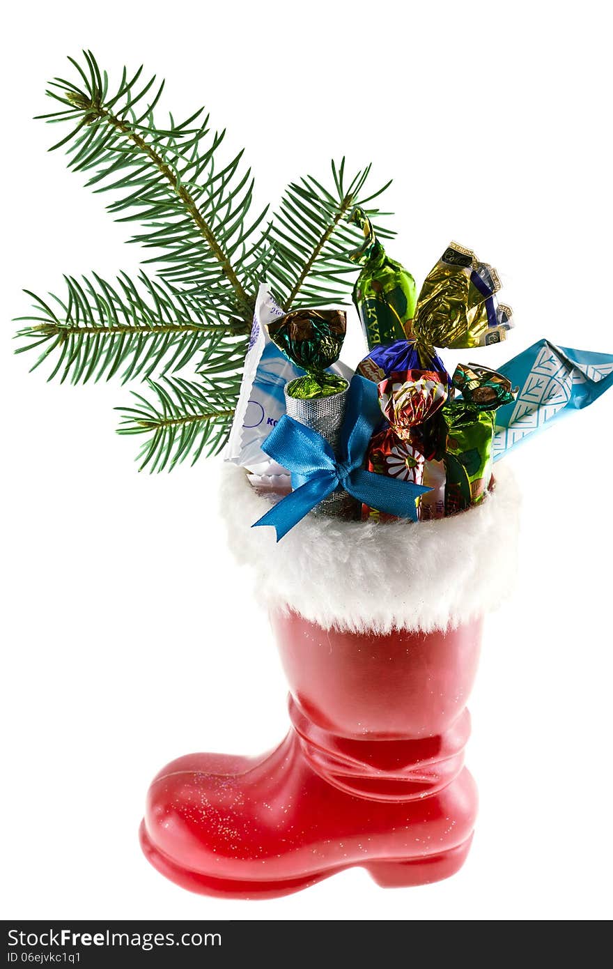 Santa's boot with gifts on a white background. Santa's boot with gifts on a white background