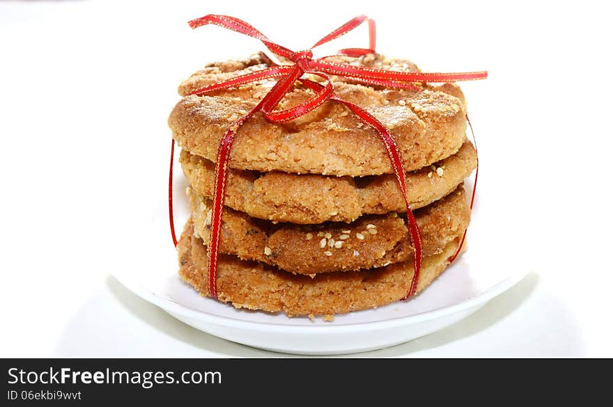 four pieces of Beijing pastries tied with a red ribbon. four pieces of Beijing pastries tied with a red ribbon