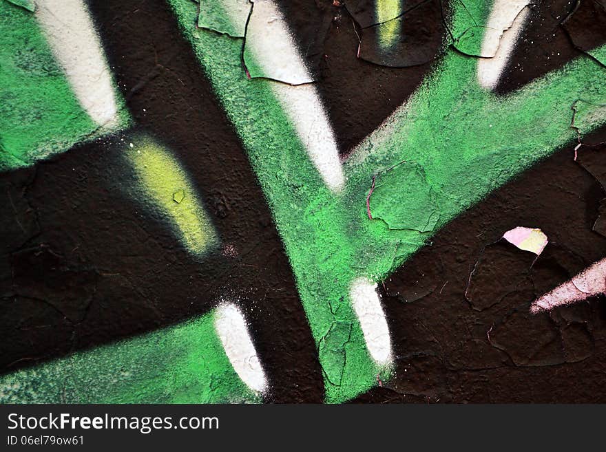 Detail of graffiti on a wall ideal for urban or grunge background. Detail of graffiti on a wall ideal for urban or grunge background.