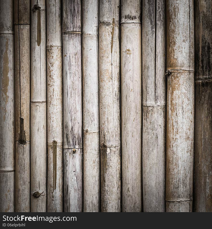 Background of grunge bamboo fence is arranged in vertical