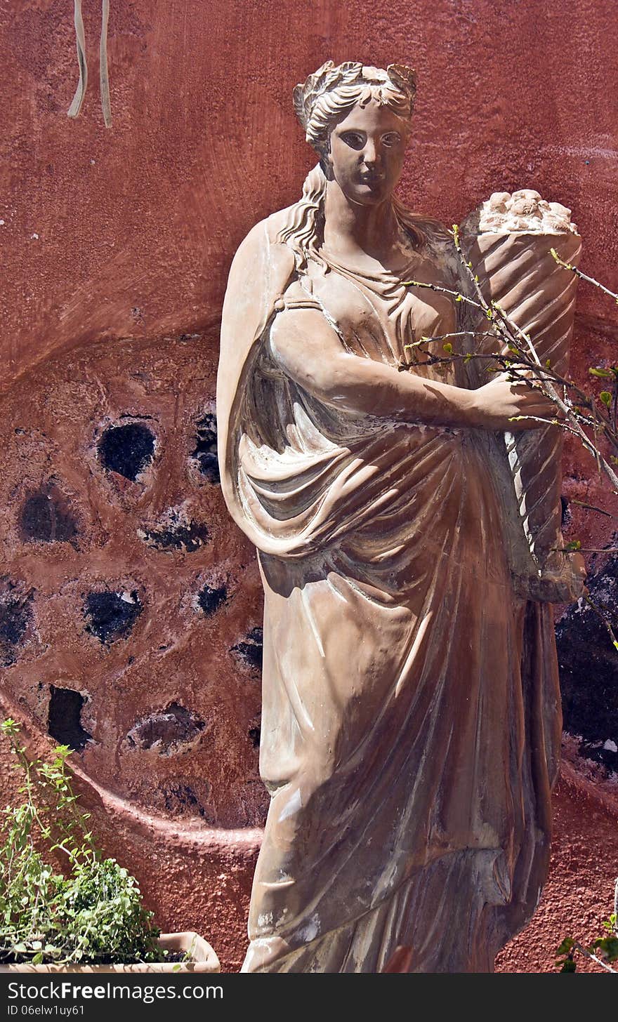 Santorini island in Greece. View of a greek classic statue of a Goddess. Santorini island in Greece. View of a greek classic statue of a Goddess