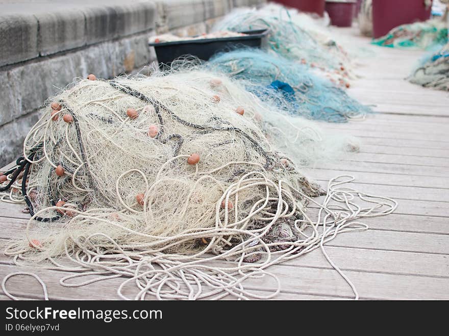 Fishing net laying on the ground in port of Prian - Slovenia