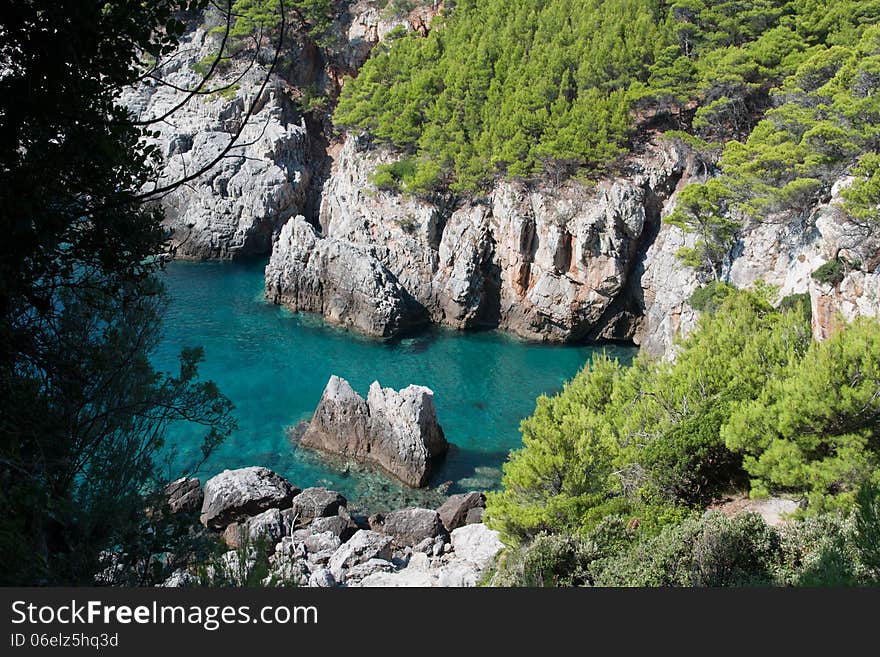 Rocky bay with green mediterranean vegetation