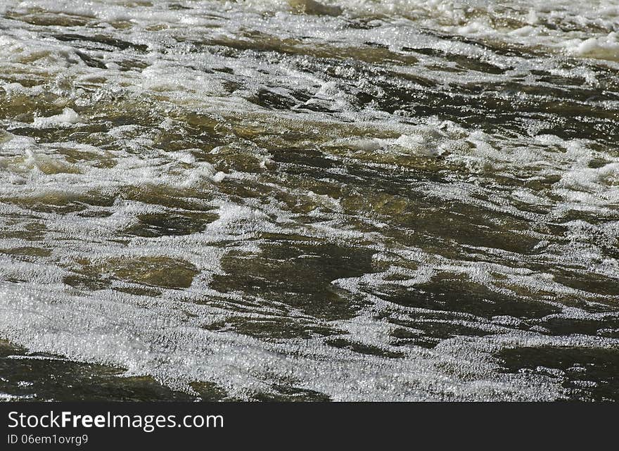 Small rapid river in winter season. Small rapid river in winter season.