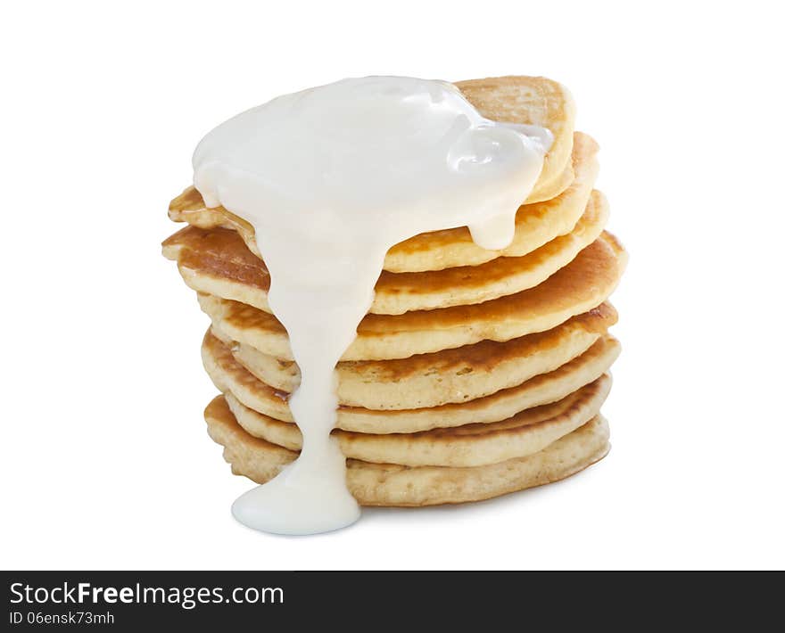 A stack of pancakes with sour cream. Isolated on white. A stack of pancakes with sour cream. Isolated on white.