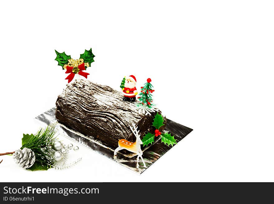 Beautiful Christmas log cake and Santa Claus on top.