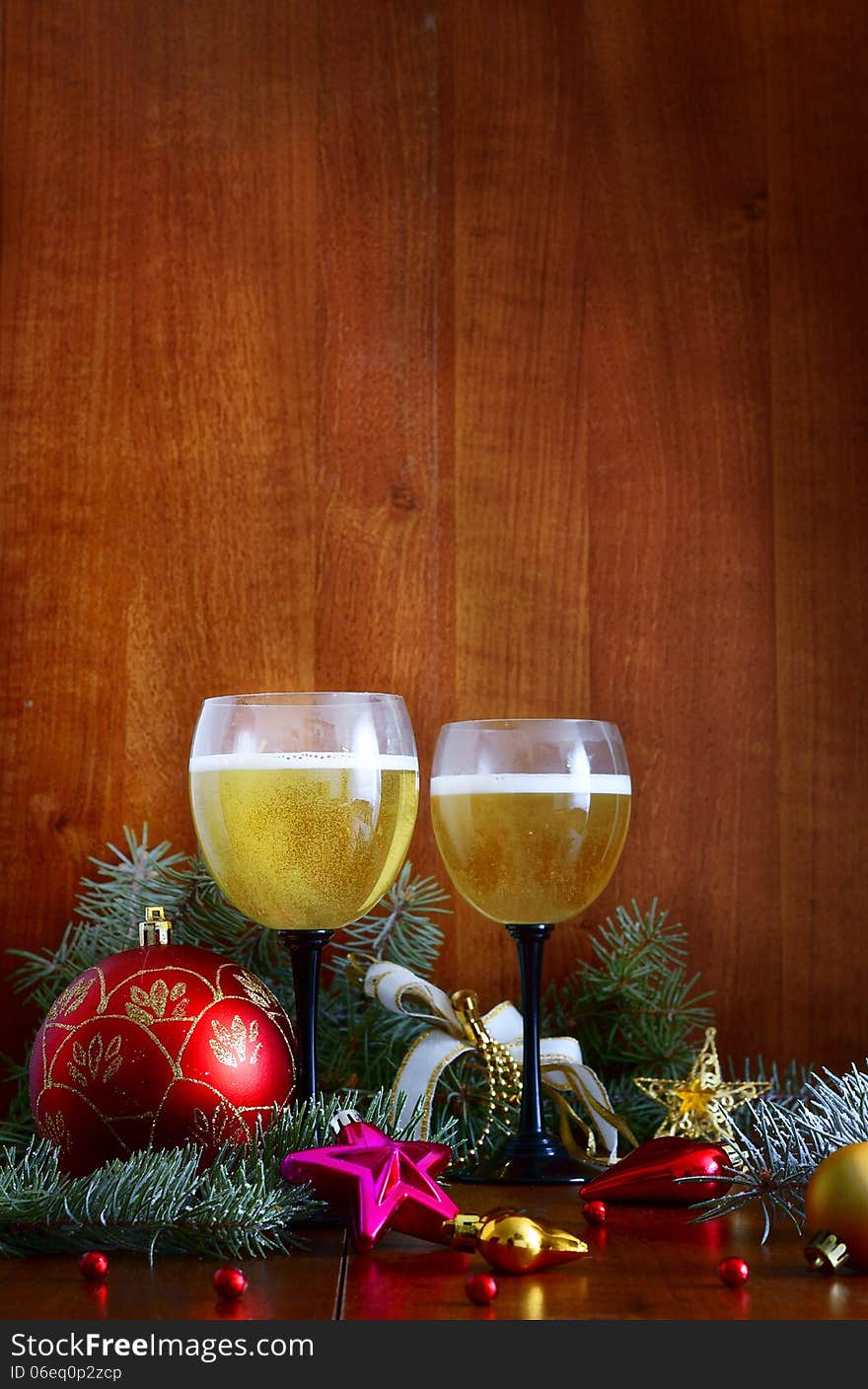 Christmas garland and a bottle of champagne in the snow before Christmas, or New Year. Christmas garland and a bottle of champagne in the snow before Christmas, or New Year