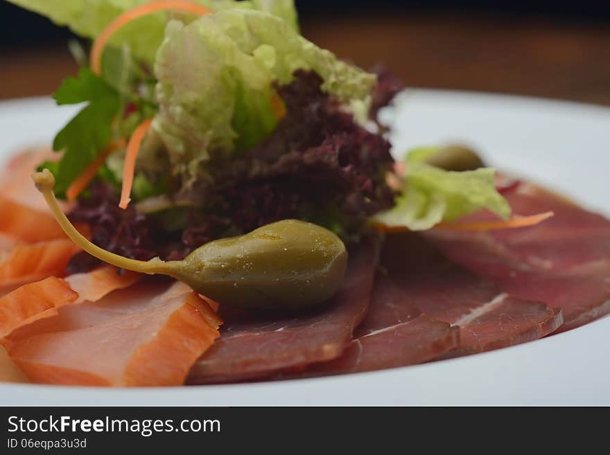 Snack, salad and a piece of meat