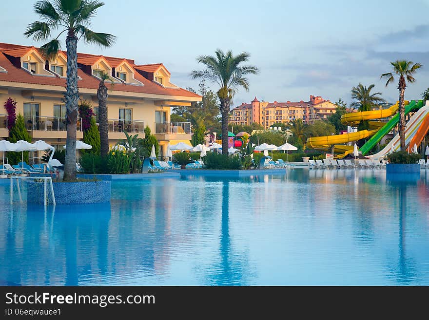 Comfortable resort hotel with a large swimming pool and water attractions on the Mediterranean sea. Comfortable resort hotel with a large swimming pool and water attractions on the Mediterranean sea.