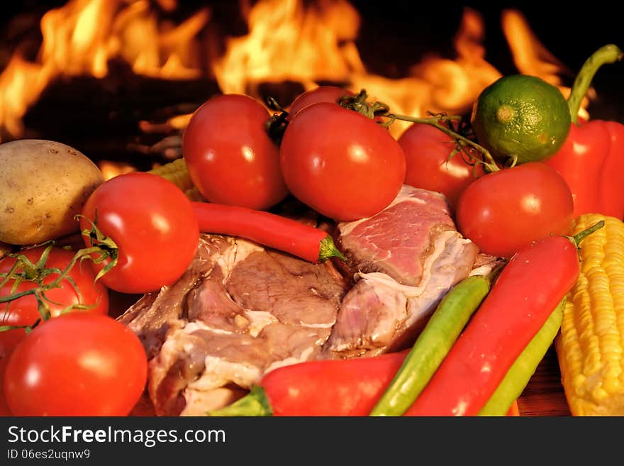 Fresh Rib steak and vegetables at the flames of coal BBQ facilities. Fresh Rib steak and vegetables at the flames of coal BBQ facilities