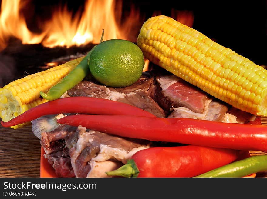 Fresh Rib steak and vegetables at the flames of coal BBQ facilit