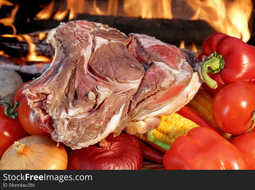 Fresh Rib steak and vegetables at the flames of coal BBQ facilities. Fresh Rib steak and vegetables at the flames of coal BBQ facilities