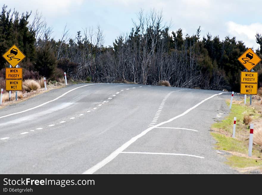 Road With Warning Signs