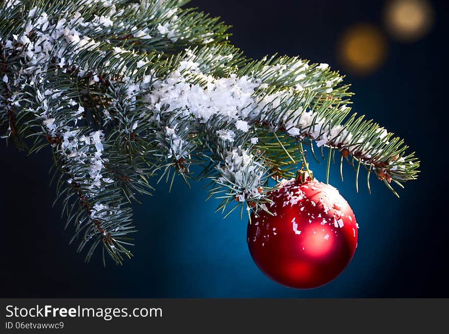 Snow-covered fir tree branch with hanging Christmas Bell. Snow-covered fir tree branch with hanging Christmas Bell