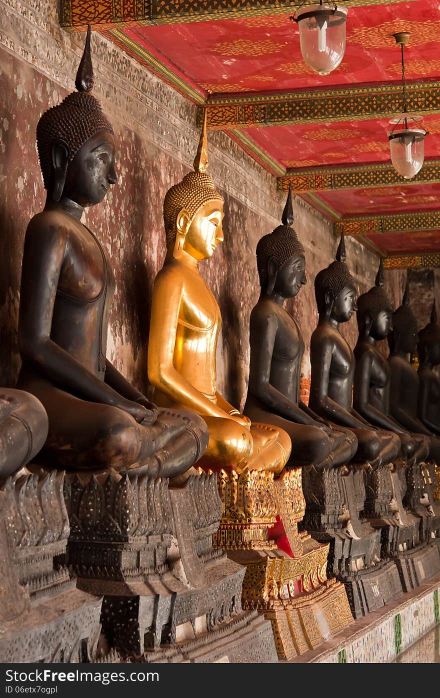 The sitting golden Buddha stute and stute and Black stute in Suthadthepwararam temple of Thailand. The sitting golden Buddha stute and stute and Black stute in Suthadthepwararam temple of Thailand