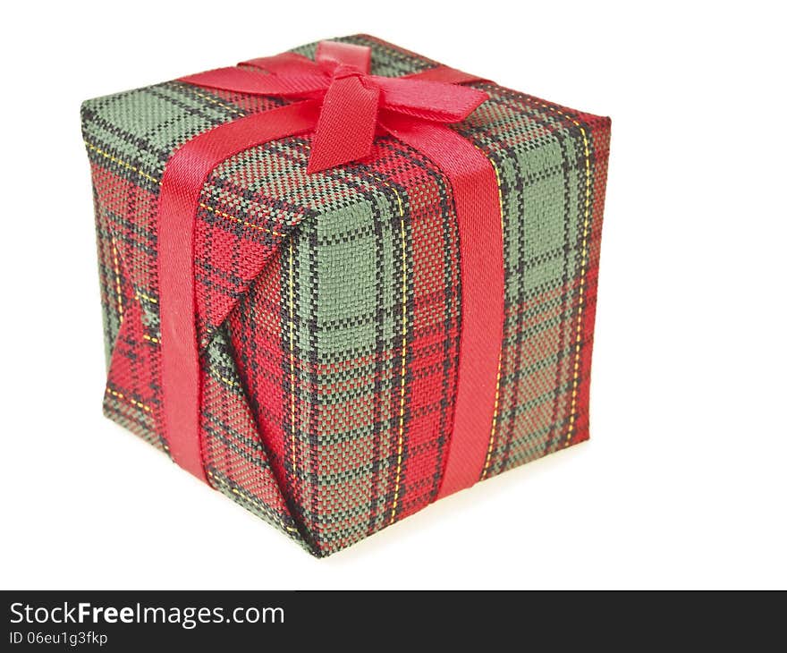 Closeup detail of red gift box on white background. Closeup detail of red gift box on white background